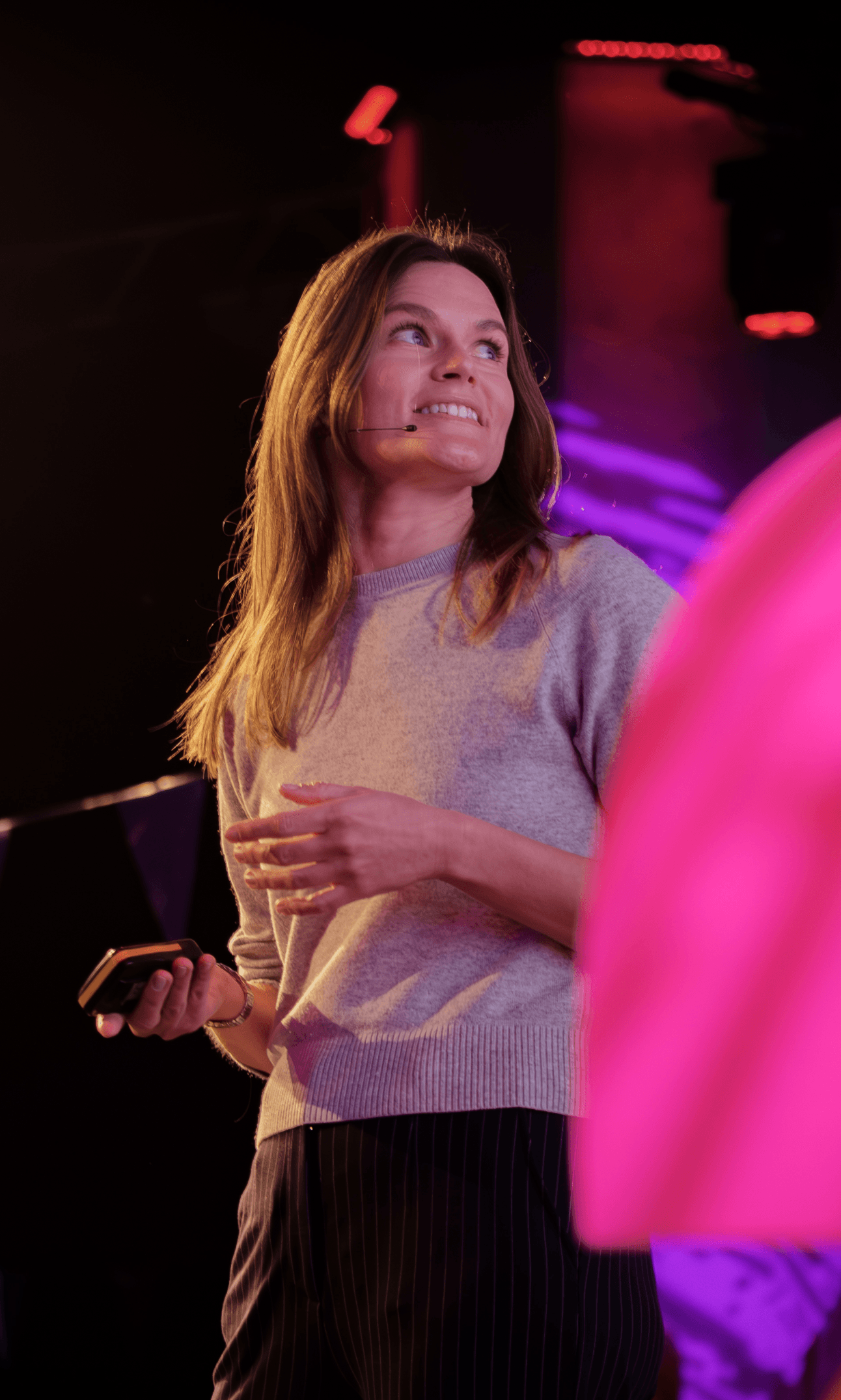Marta Strykowska speaking on stage at an AI event